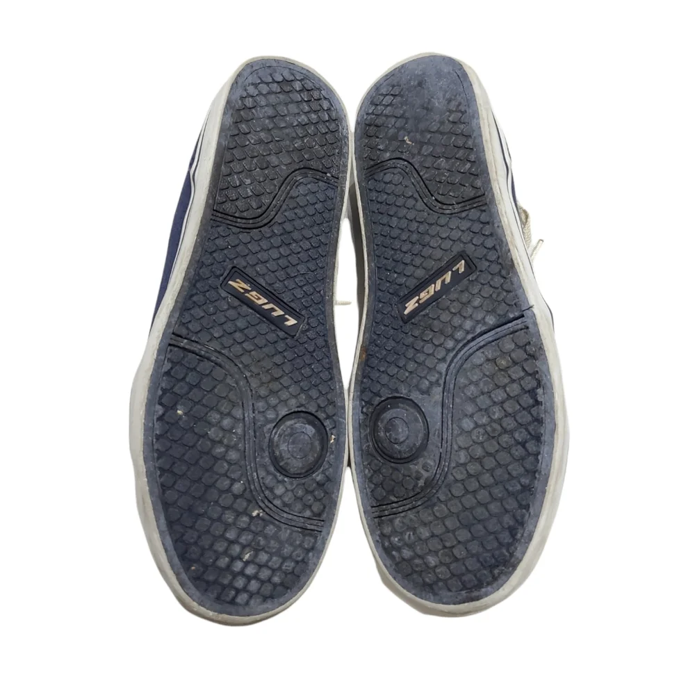 Men's blue and white Lugz sneakers.